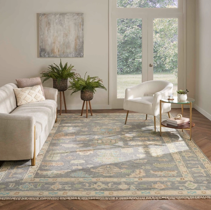 light patterned area rug in a Sand City home office with hardwood floors