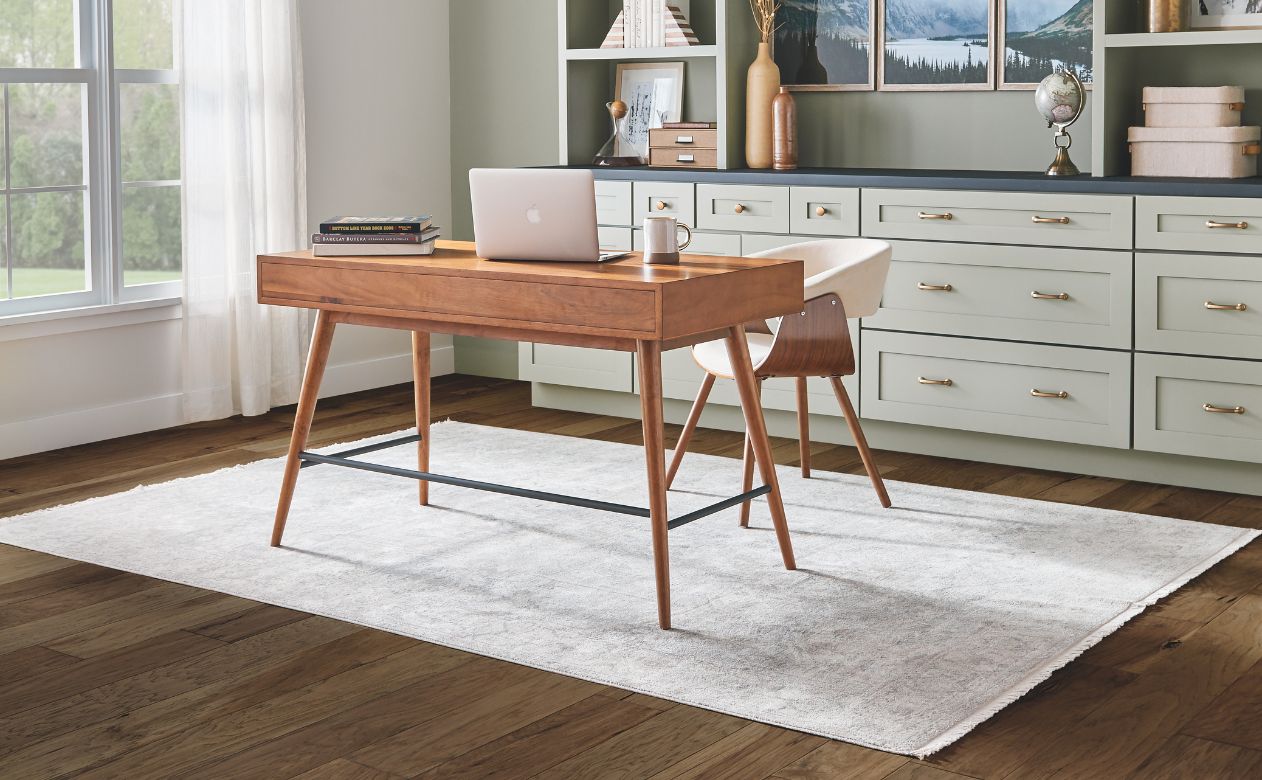 light patterned area rug in a Sand City home office with hardwood floors