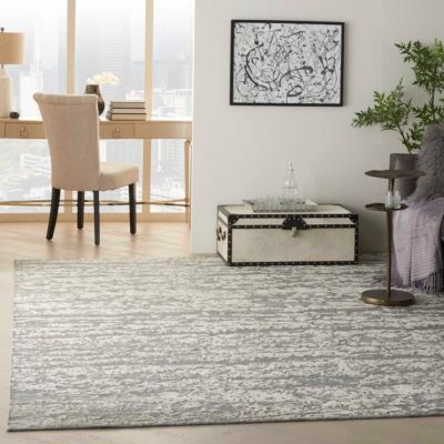 grey textured area rug in a bright Sand City apartment